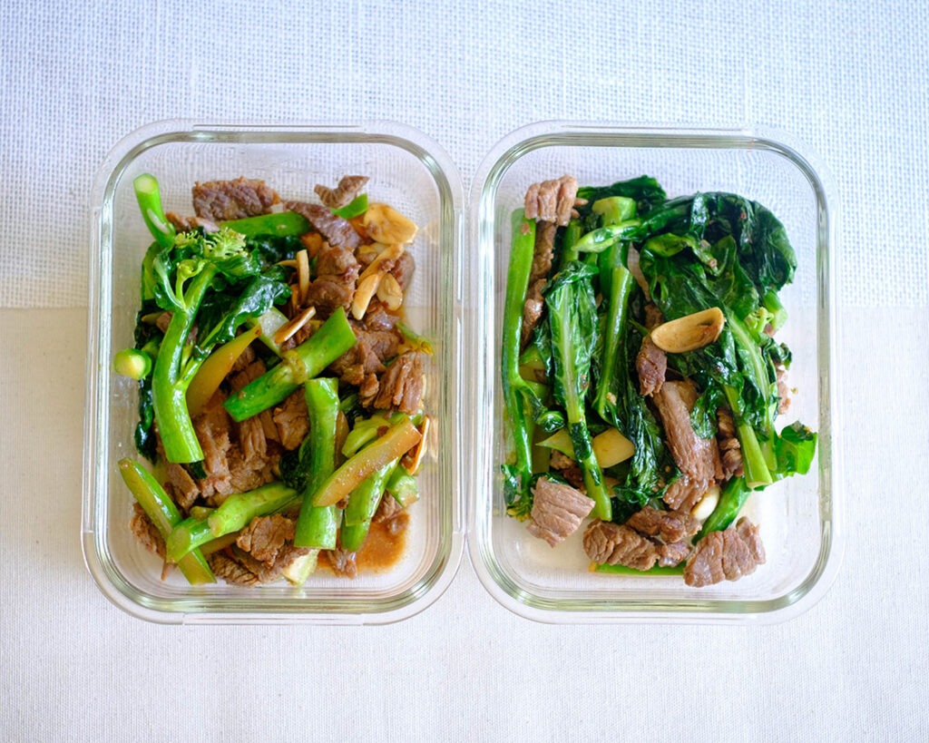 Round plate with steak strips and Chinese broccoli.