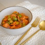 round bowl with sausage, celery, okra, in a tomato stew