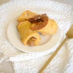 round plate with sausage wrapped in french toast