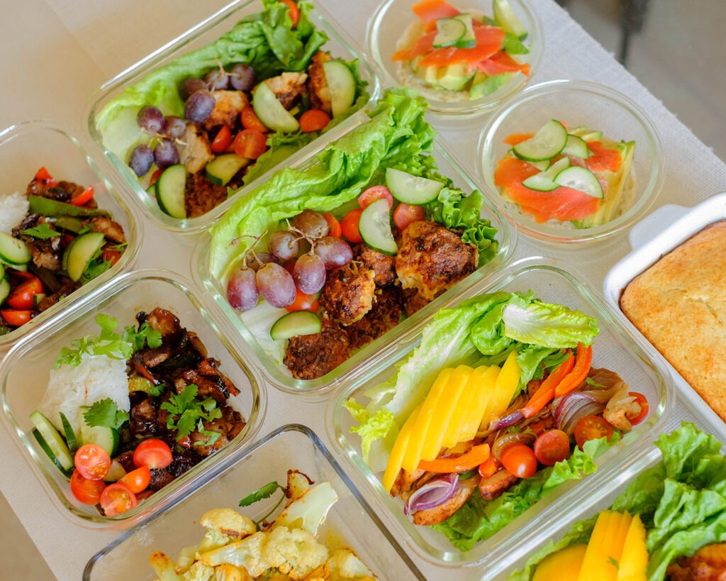 glass meal prep containers filled with chicken meatball lettuce wraps - a healthy lunch idea