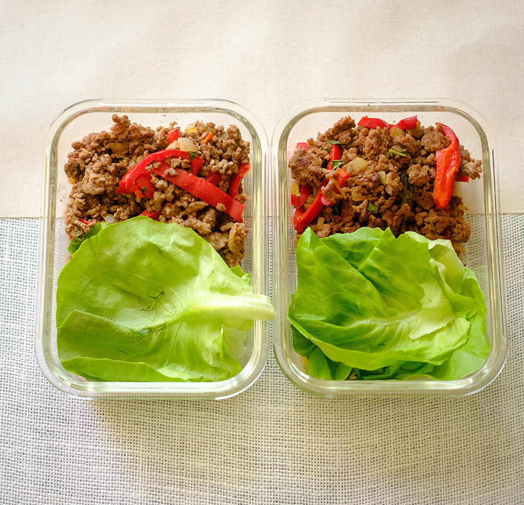 asian beef lettuce wraps in meal prep containers