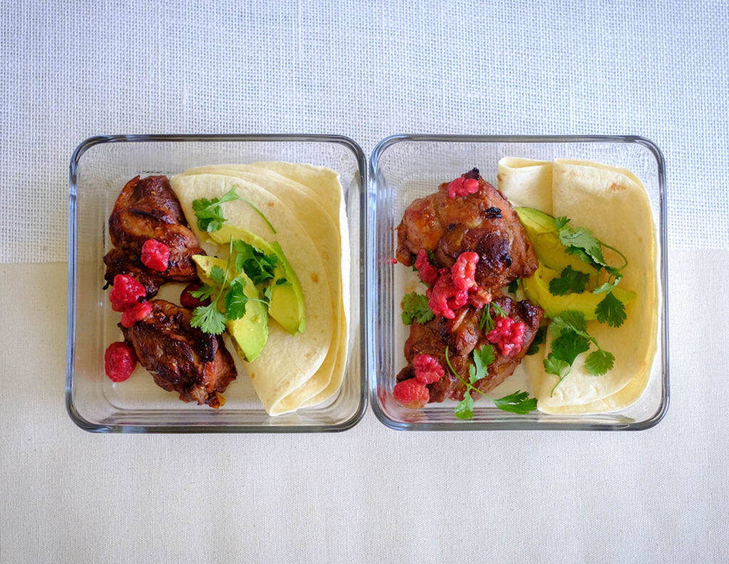 raspberry chicken soft tacos in glass meal prep containers