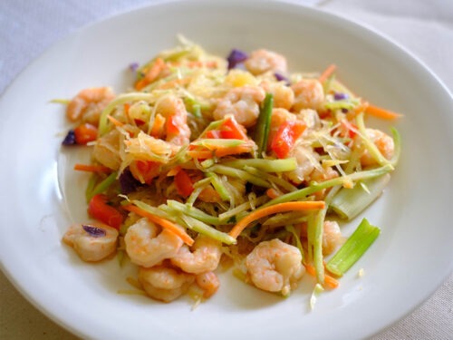 shrimp with spaghetti squash in round plate