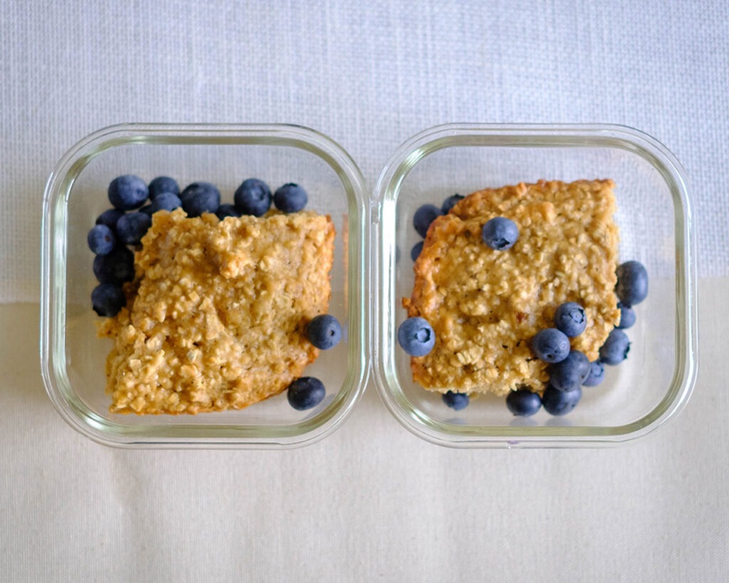 round plate with honey oat muffin bars and blueberries