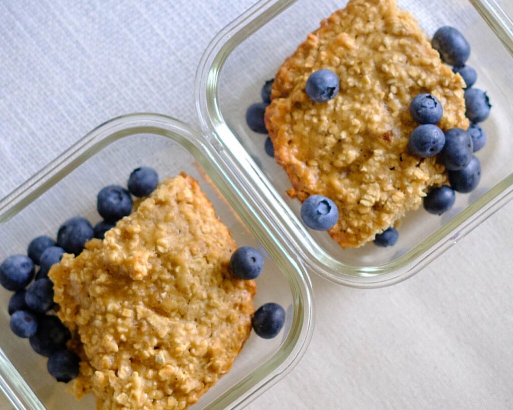 round plate with honey oat muffin bars and blueberries
