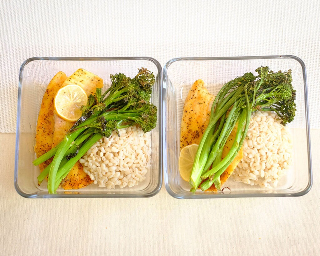 rectangle glass containers with tilapia fillet, broccolini, and barley - tilapia recipe perfect for meal prep
