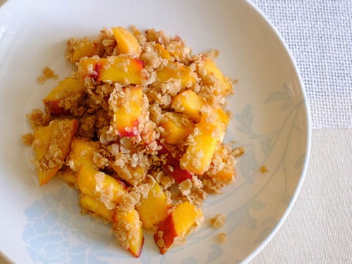 round plate with diced peaches and rolled oats