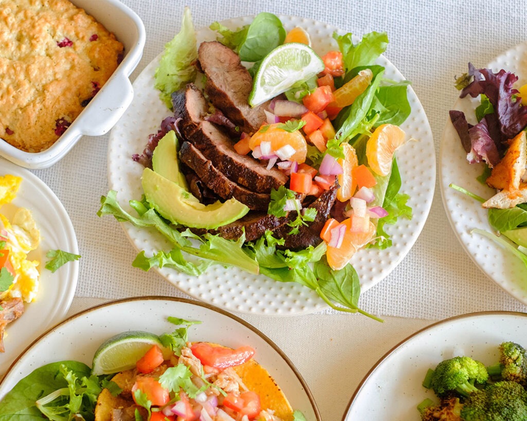 round plate with steak and orange salsa