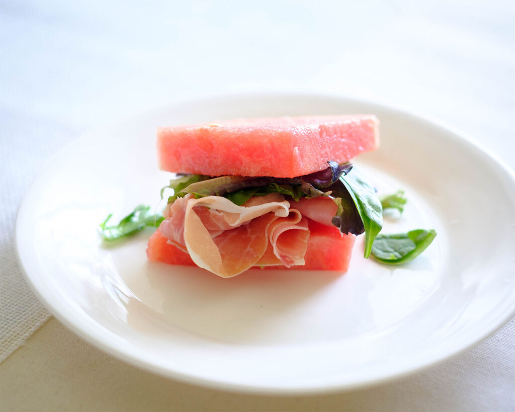 watermelon with prosciutto and spring mix