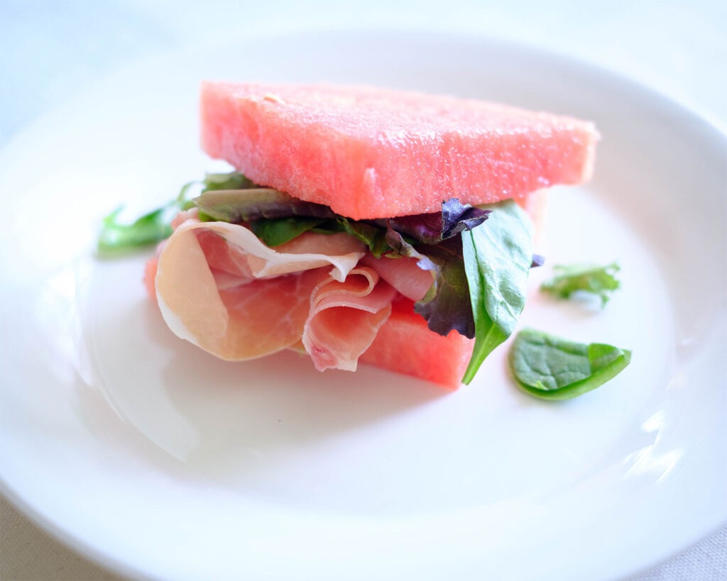 watermelon with prosciutto and spring mix