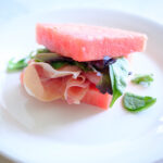 watermelon with prosciutto and spring mix