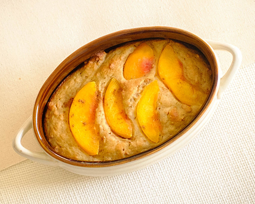 oval baking dish with peach muffin bar