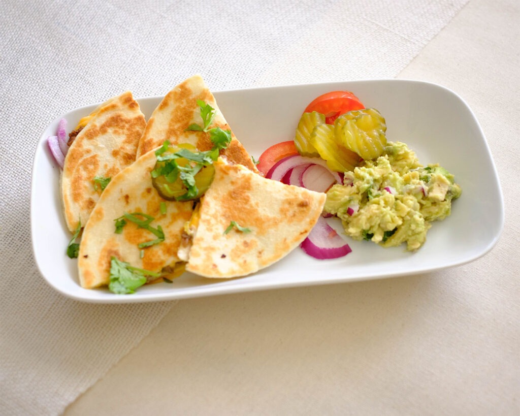 plate with quesadillas and guacamole