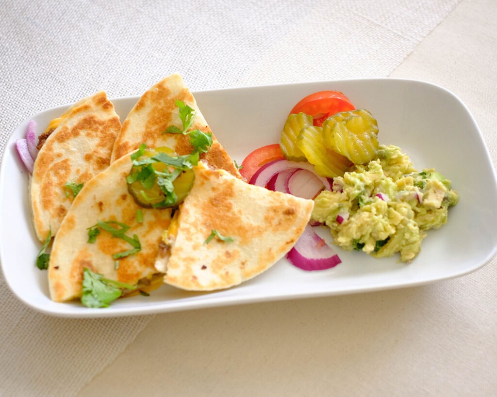 plate with quesadillas and guacamole