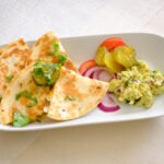 plate with quesadillas and guacamole