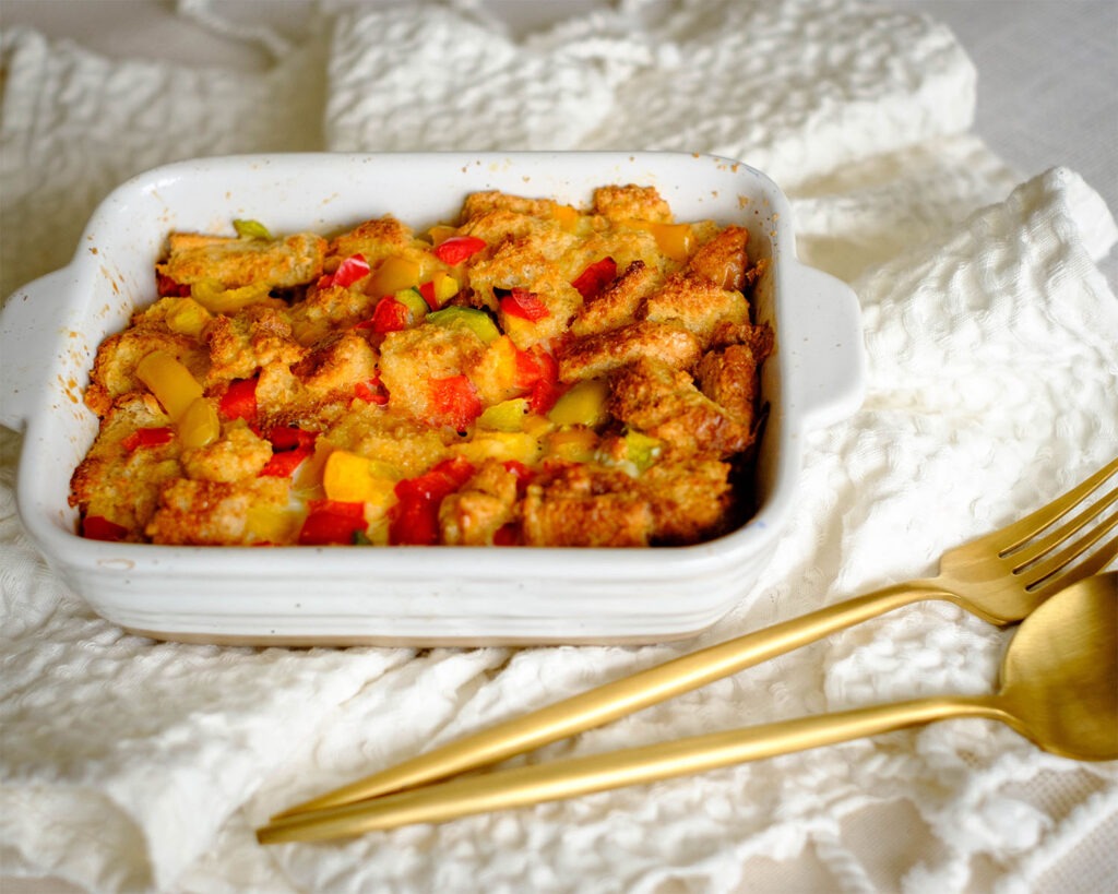 rectangle baking dish with bread pudding with bell peppers