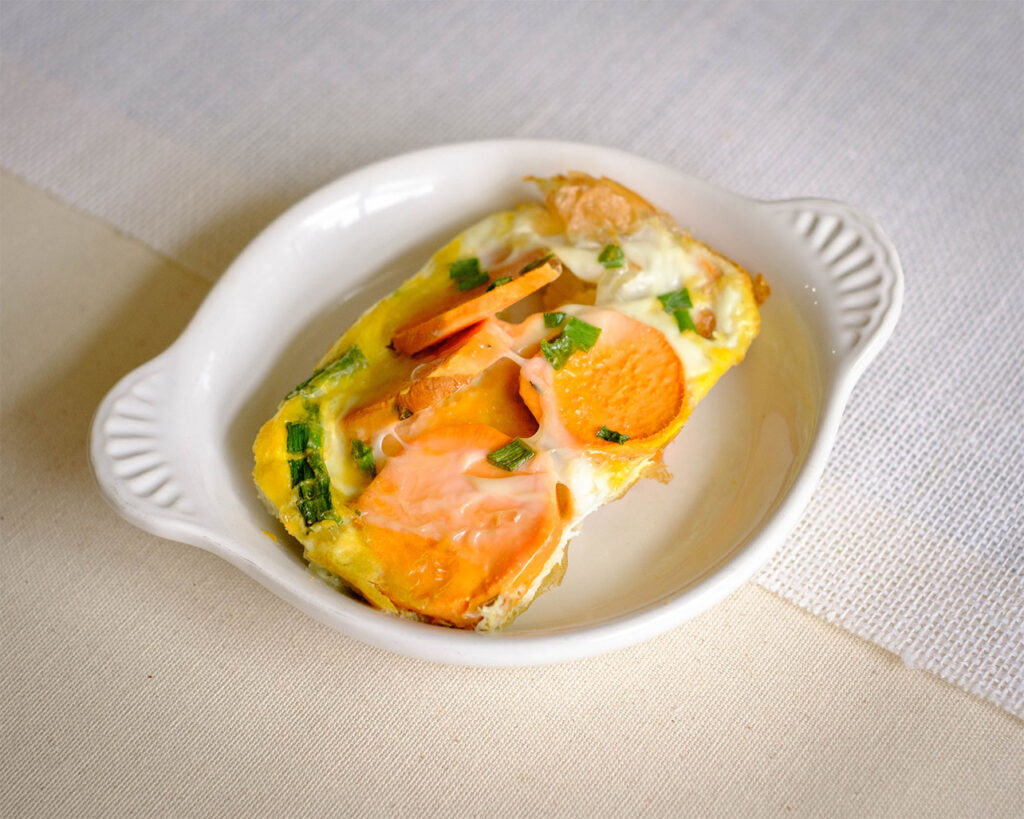 round plate with baked egg frittata and sweet potato