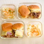 glass meal prep containers with bbq beef sliders and coleslaw