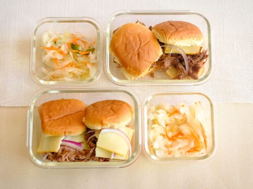 glass meal prep containers with bbq beef sliders and coleslaw