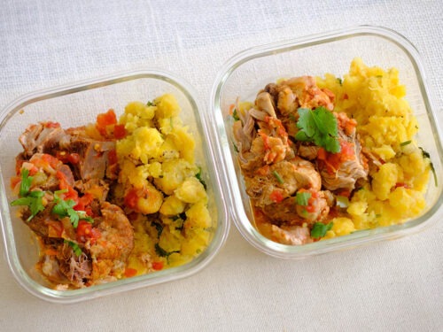 glass meal prep containers with shredded pork with mashed plaintains