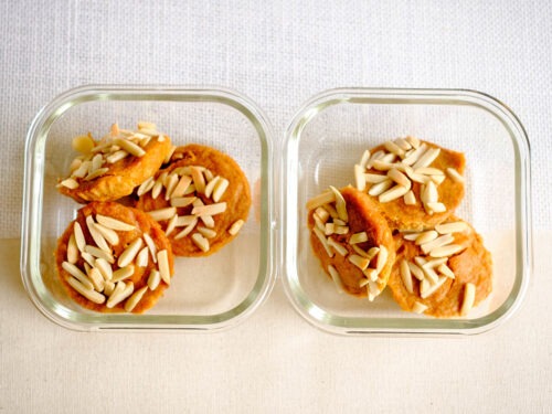 glass meal prep containers with persimmon muffins