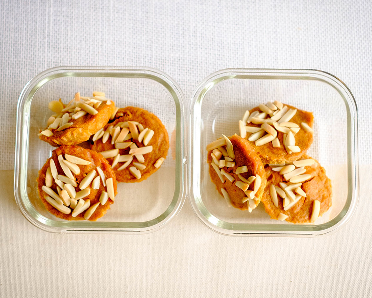 glass meal prep containers with persimmon muffins