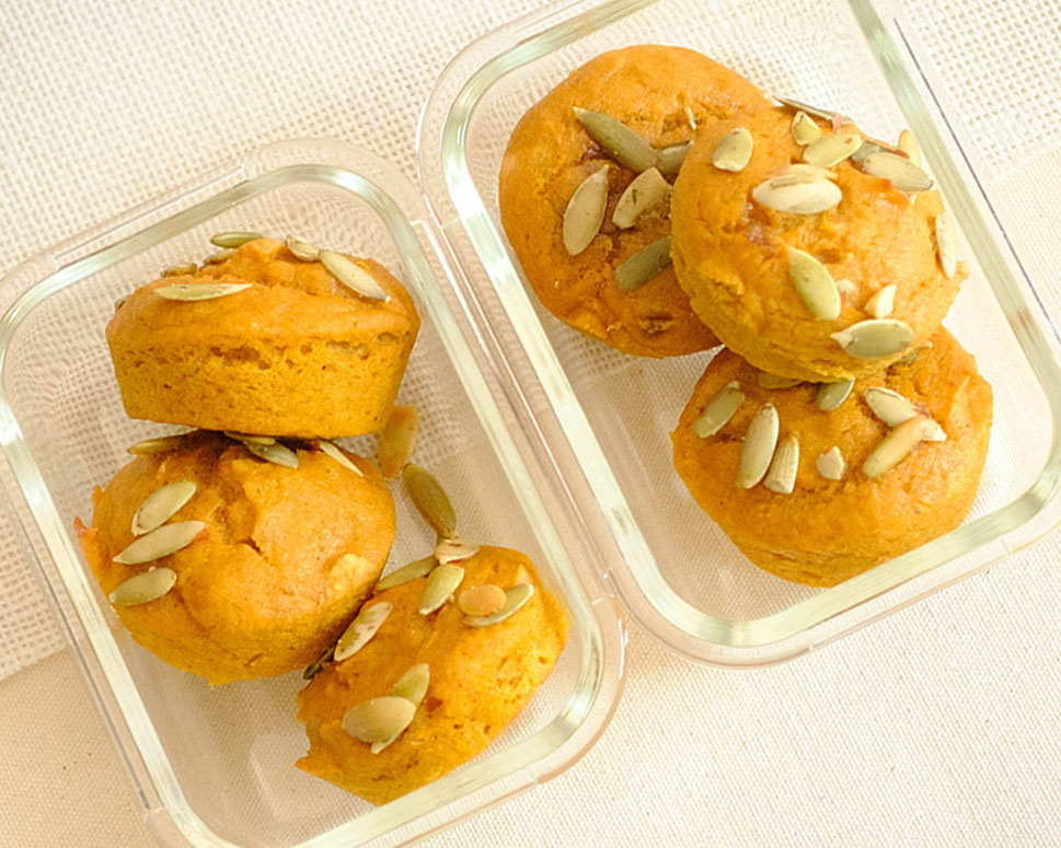 glass meal prep containers with pumpkin muffins