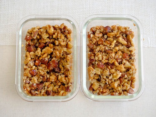 glass meal prep containers with date, rolled oats, and walnut granola