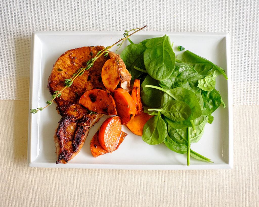 balsamic glazed porkchops with persimmons and baby spinach