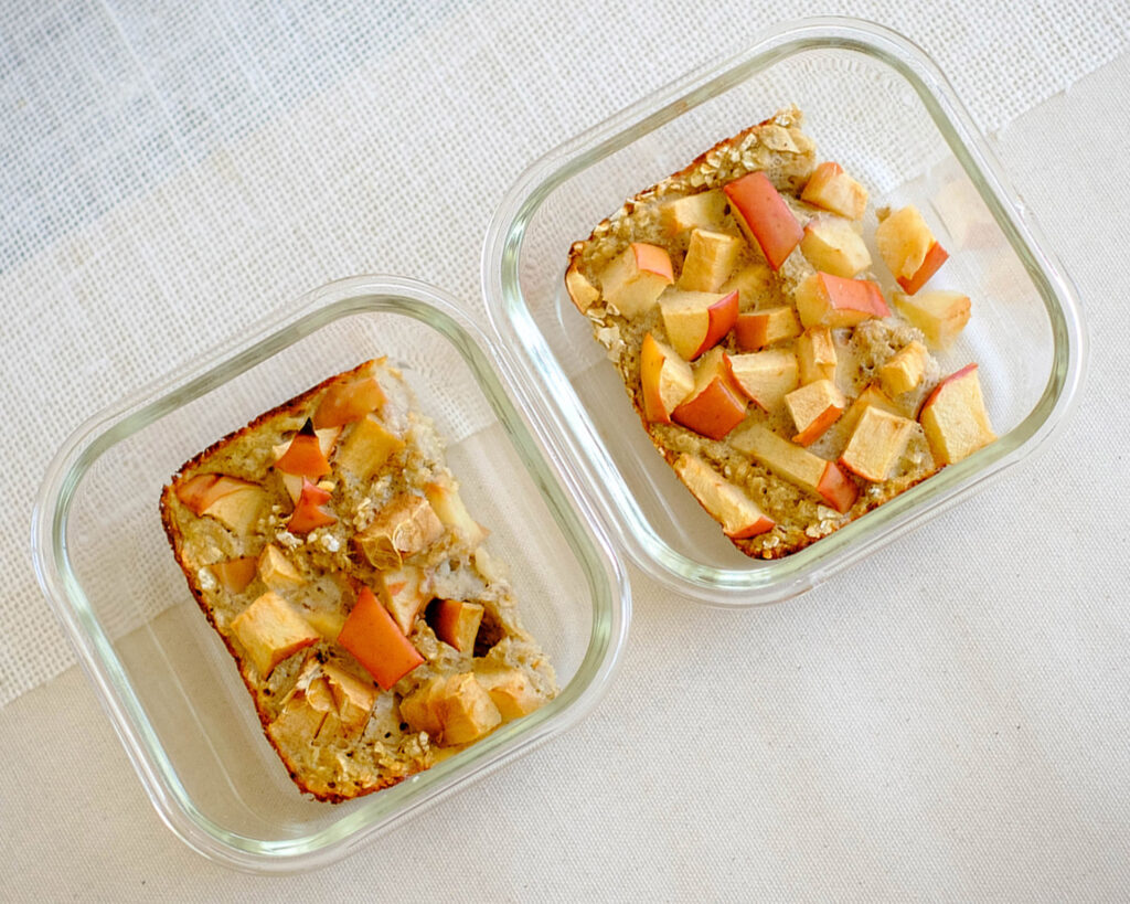 glass meal prep containers with apple oatmeal breakfast muffin bars