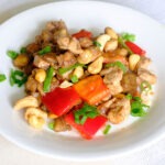 Chicken Stir Fry with cashews, red bell peppers, eggplant, and green onions