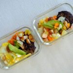 Turkey Sausage Patties with scrambled eggs, diced potatoes and bell peppers, and sliced avocado
