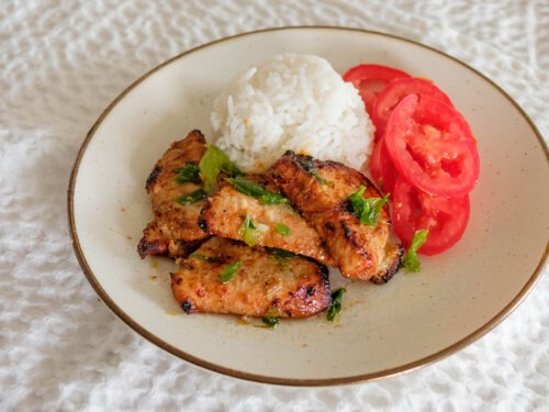 pork loin slices with white rice and sliced tomatoes