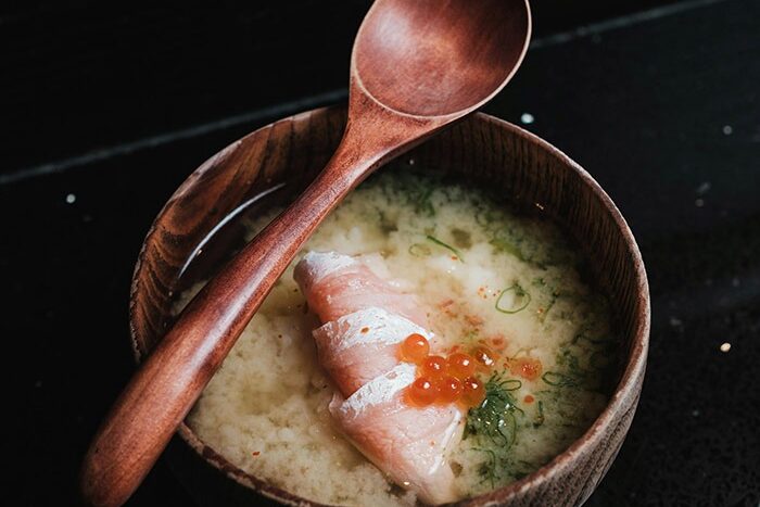 meal prep with miso soup in a bowl with a spoon