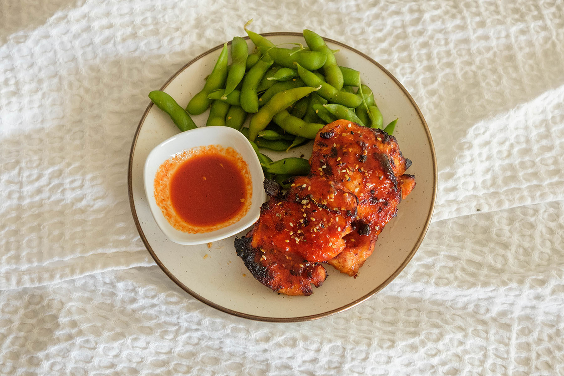 Air Fryer Chicken with edamame and hot honey gochujang sauce
