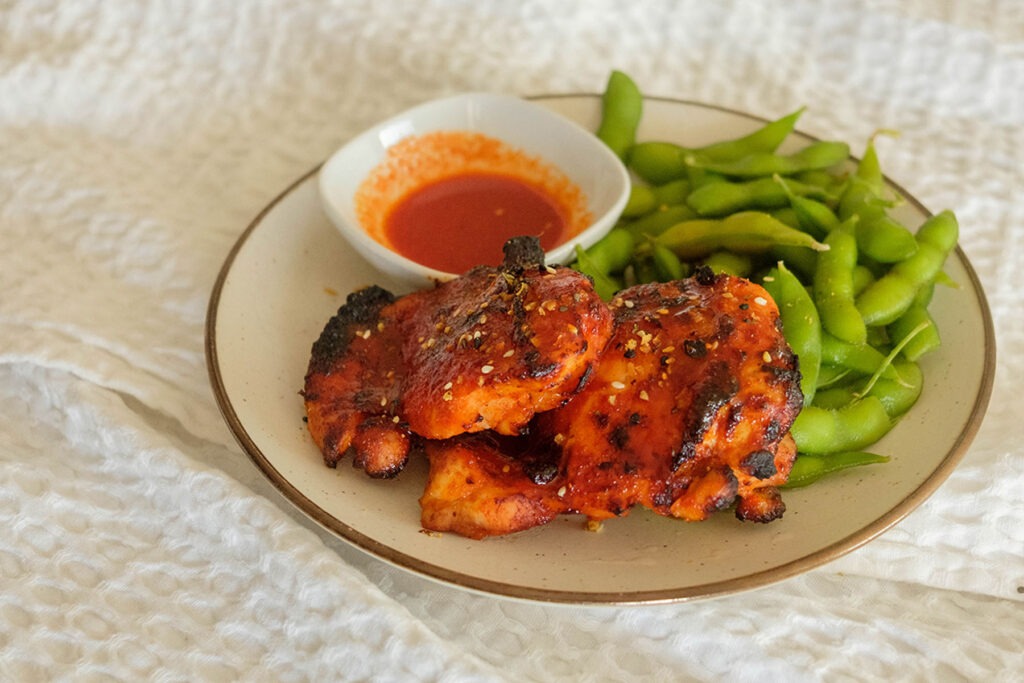 Air Fryer Chicken with edamame and hot honey gochujang sauce